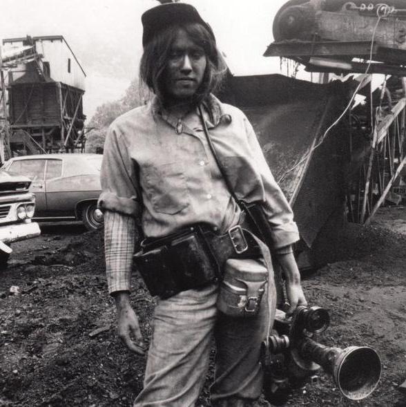 grey scale photo of Barbara Kopple holding camera